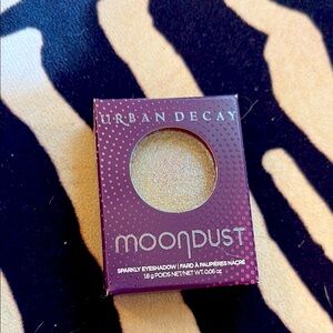 Urban Decay Moondust Eyeshadow in Shimmering gold/green/blue sparkle topper. New